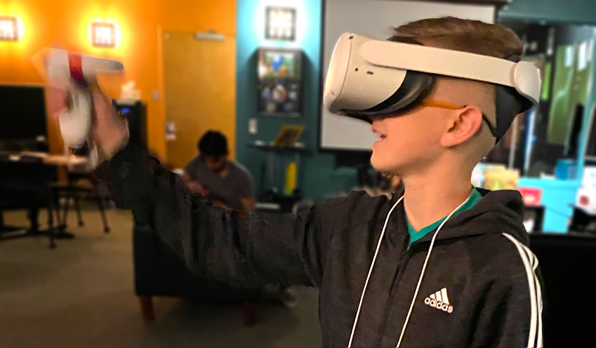 student playing game on VR